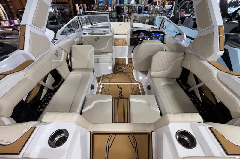Slide: The Image of 2026 Tigé 22RZX boat interior with luxurious seating and modern dashboard. - 12