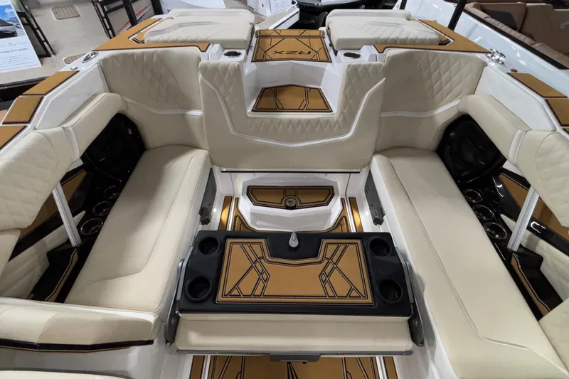 Slide: The Image of Luxurious interior of 2026 Tigé 22RZX boat with beige seating and stylish design. - 15