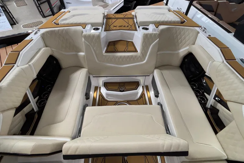 Slide: The Image of 2026 Tigé 22RZX boat interior with beige seating and stylish design. - 16