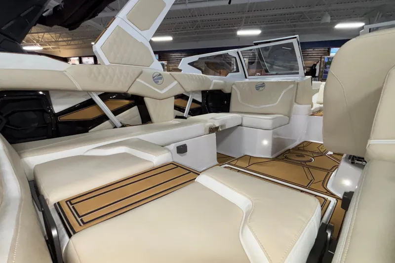 Slide: The Image of Luxurious interior of 2026 Tigé 22RZX boat with beige seating and stylish flooring. - 24