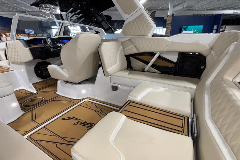 Slide: The Image of Luxurious interior of 2026 Tigé 22RZX boat with beige seating and modern design. - 26