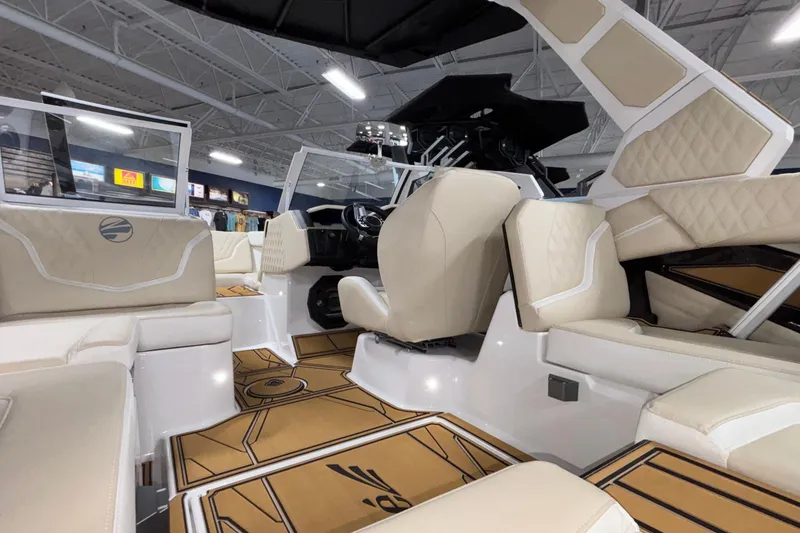 Slide: The Image of 2026 Tigé 22RZX boat interior with beige seating and modern design. - 27