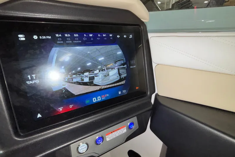 Slide: The Image of Touchscreen display in 2026 Tigé 22RZX boat showing control interface and settings. - 31