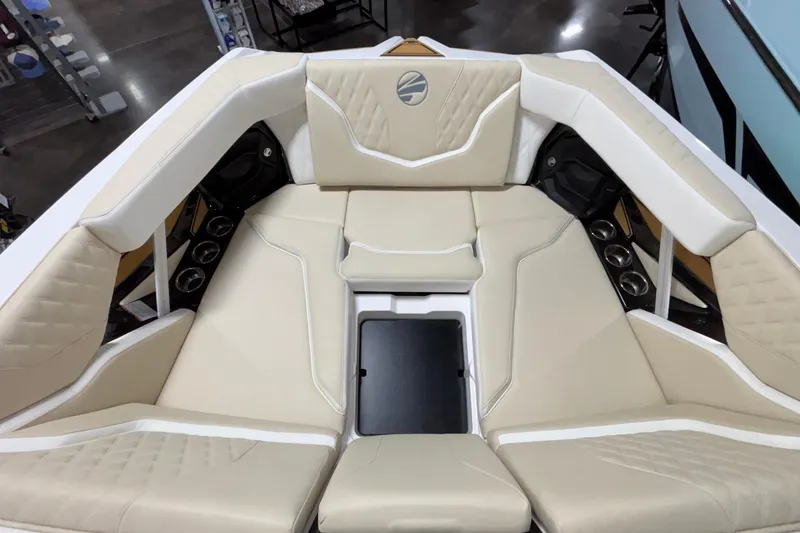 Slide: The Image of Luxurious interior of 2026 Tigé 22RZX boat with beige seating and cup holders. - 45