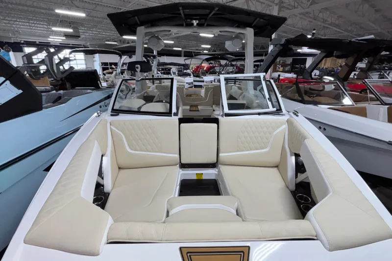 Slide: The Image of 2026 Tigé 22RZX boat interior with beige seating in showroom. - 47