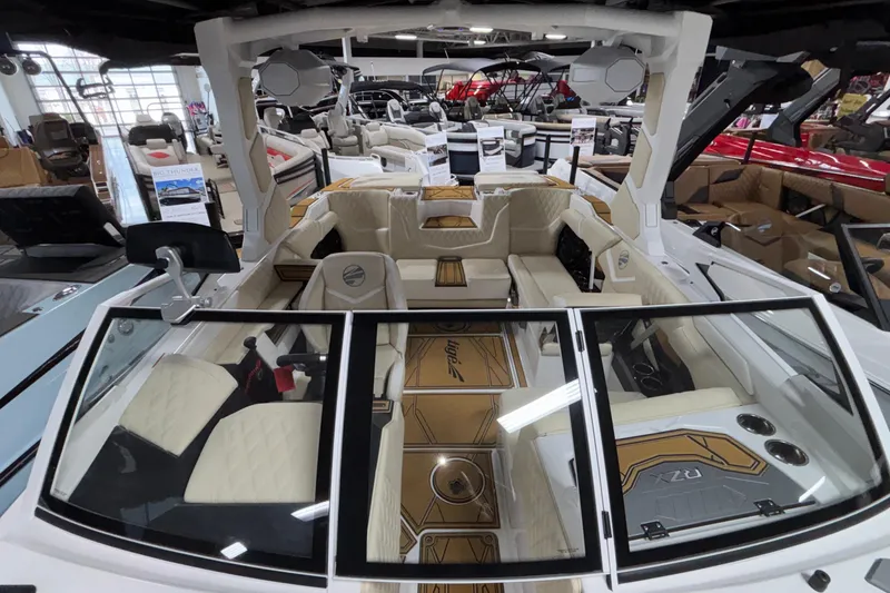 Slide: The Image of 2026 Tigé 22RZX boat interior with luxurious seating and modern design in showroom. - 52