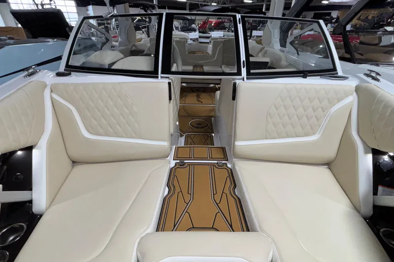 Slide: The Image of 2026 Tigé 22RZX boat interior with beige seating and stylish flooring. - 53