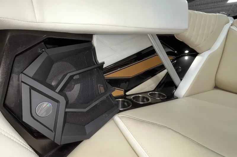 Slide: The Image of Interior of 2026 Tigé 22RZX boat featuring speaker and cup holders. - 54