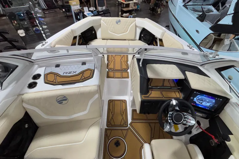 Slide: The Image of 2026 Tigé 22RZX boat interior with luxurious seating and advanced dashboard controls. - 56