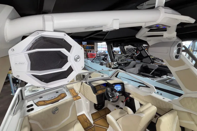 Slide: The Image of Interior of 2026 Tigé 22RZX boat with advanced audio system and luxurious seating. - 57