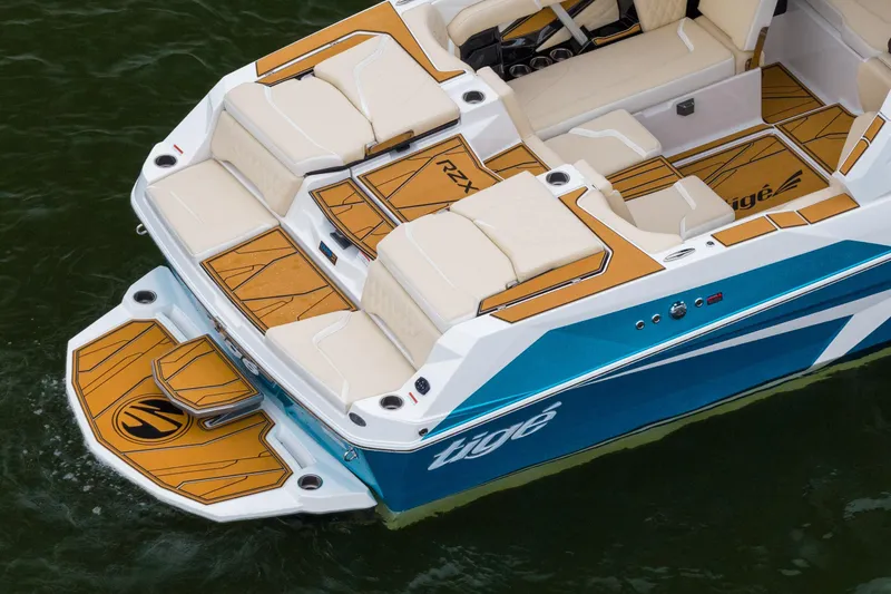Slide: The Image of 2026 Tigé 22RZX boat with sleek design and luxurious seating on the water. - 6