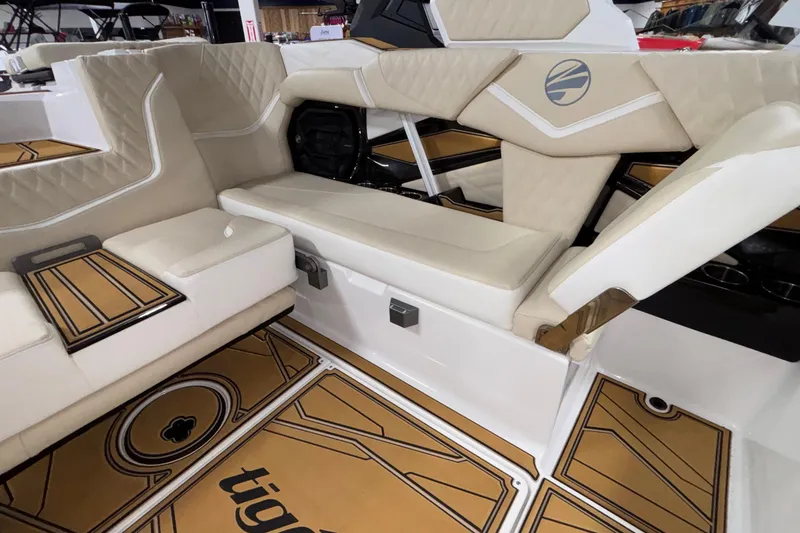 Slide: The Image of Luxurious interior of 2026 Tigé 22RZX boat with beige seating and stylish flooring. - 63