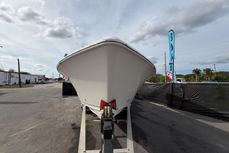 Slide: The Image of 2018 Blue Wave 2800 Pure Hybrid boat on trailer, outdoor display. - 11