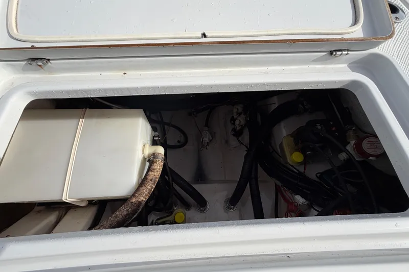 Slide: The Image of Open compartment of 2018 Blue Wave 2800 Pure Hybrid boat showing internal components. - 15