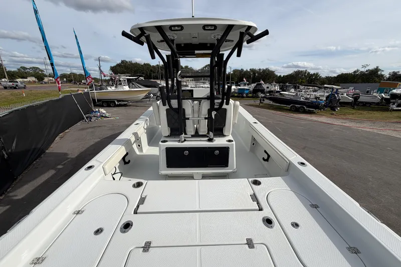 Slide: The Image of 2018 Blue Wave 2800 Pure Hybrid boat on display at a sale event. - 16