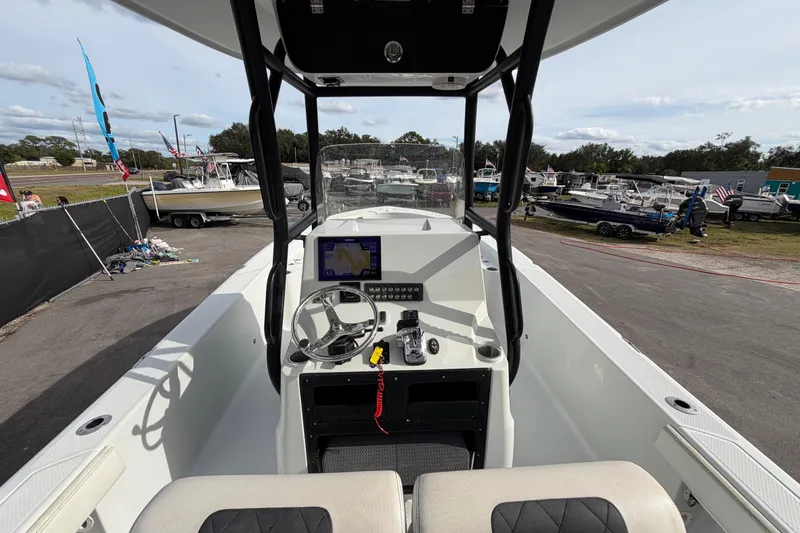 Slide: The Image of 2018 Blue Wave 2800 Pure Hybrid boat storage compartment with cup holders and seating. - 20