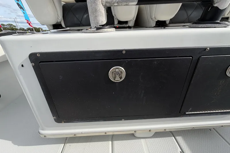 Slide: The Image of 2018 Blue Wave 2800 Pure Hybrid boat storage compartment with secure latch. - 21