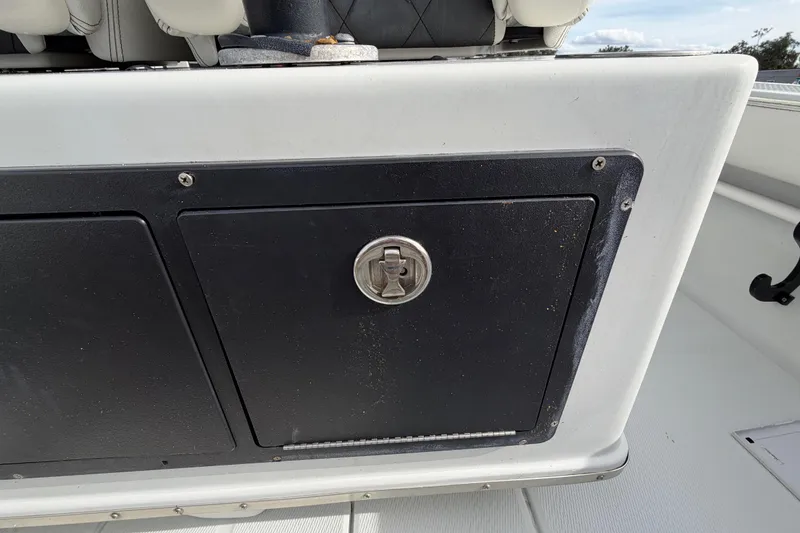 Slide: The Image of Open storage compartment on 2018 Blue Wave 2800 Pure Hybrid boat. - 23