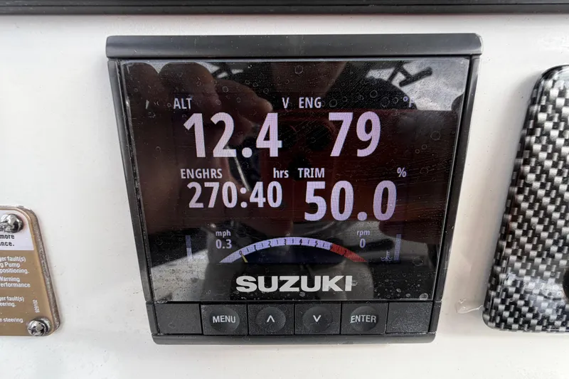 Slide: The Image of 2018 Blue Wave 2800 Pure Hybrid boat interior with steering console and seating. - 27