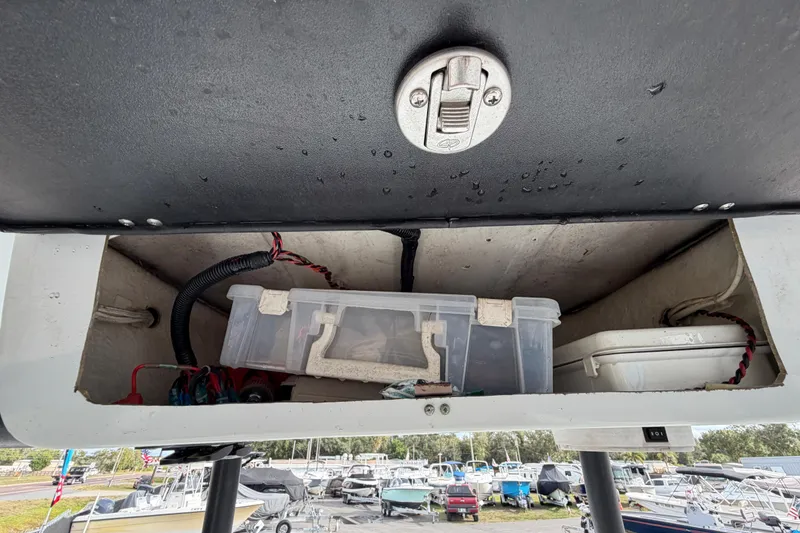 Slide: The Image of Control panel of a 2018 Blue Wave 2800 Pure Hybrid boat with Suzuki and Lenco switches. - 32