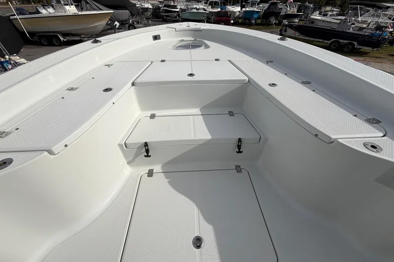 Slide: The Image of 2018 Blue Wave 2800 Pure Hybrid boat console with storage compartment and latch. - 38