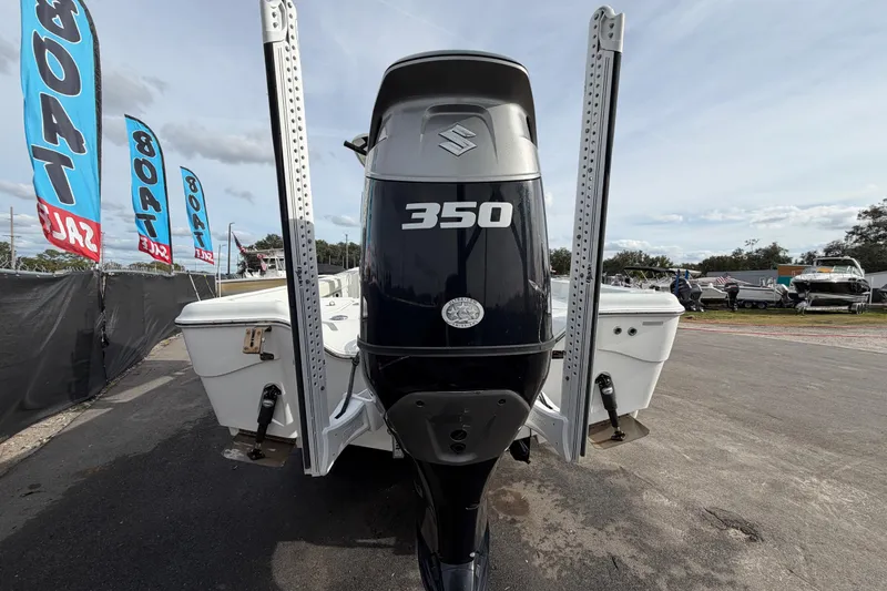 Slide: The Image of 2018 Blue Wave 2800 Pure Hybrid boat with Suzuki 350 engine at a sale event. - 4