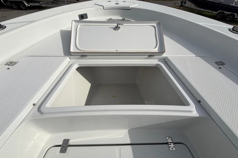 Slide: The Image of Interior of 2018 Blue Wave 2800 Pure Hybrid boat with portable toilet and paper towel holder. - 43