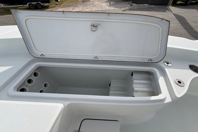 Slide: The Image of 2018 Blue Wave 2800 Pure Hybrid boat interior with seating and storage compartments. - 46