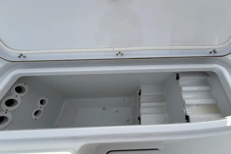 Slide: The Image of 2018 Blue Wave 2800 Pure Hybrid boat interior with cushioned seating and storage compartments. - 47