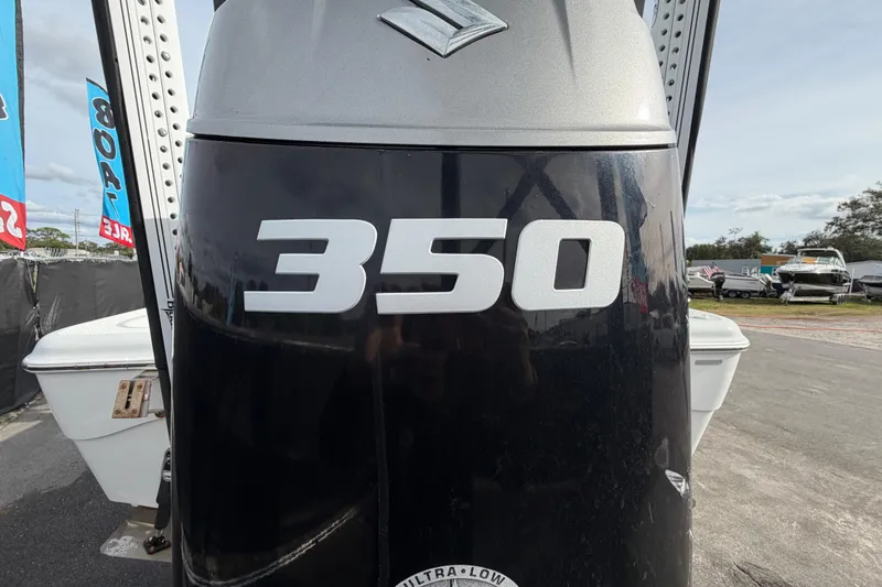Slide: The Image of Outboard motor on 2018 Blue Wave 2800 Pure Hybrid boat at sale event. - 5