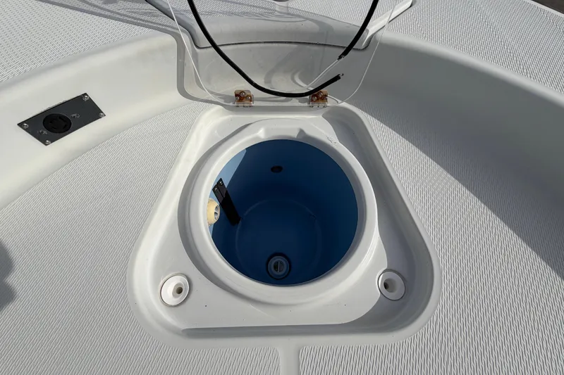 Slide: The Image of Open storage compartment on a 2018 Blue Wave 2800 Pure Hybrid boat. - 51