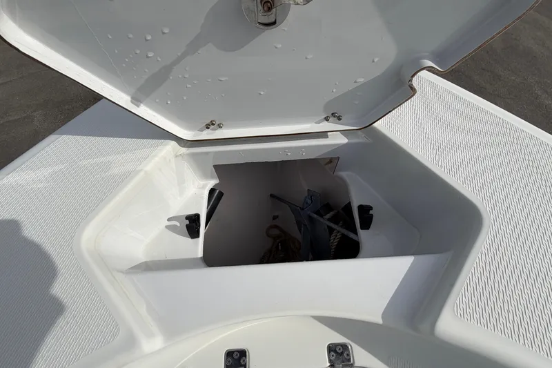 Slide: The Image of Open storage compartment on 2018 Blue Wave 2800 Pure Hybrid boat. - 53