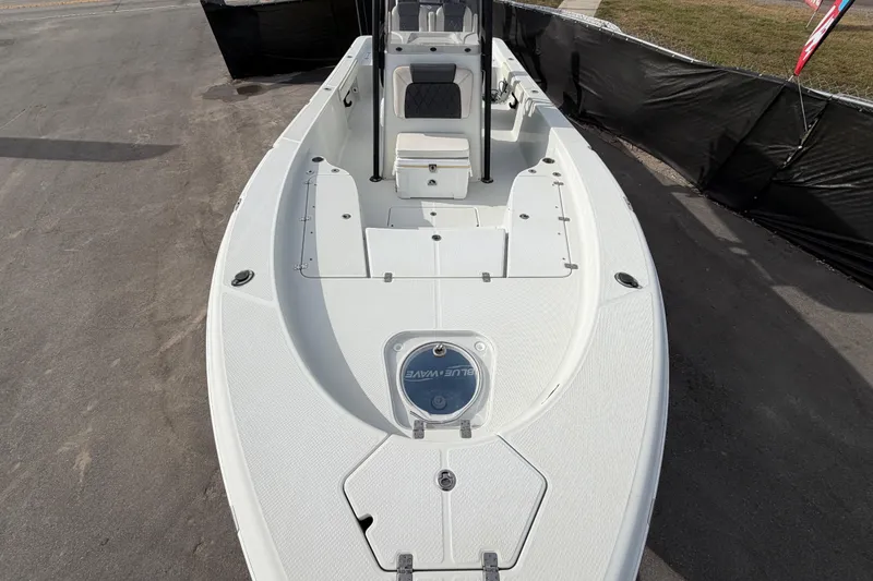Slide: The Image of 2018 Blue Wave 2800 Pure Hybrid boat deck with textured surface and storage compartments. - 54