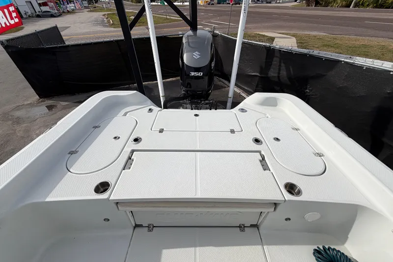 Slide: The Image of 2018 Blue Wave 2800 Pure Hybrid boat displayed outdoors on a sunny day. - 64