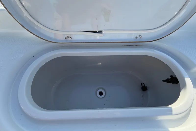 Slide: The Image of Open storage compartment on 2018 Blue Wave 2800 Pure Hybrid boat. - 78