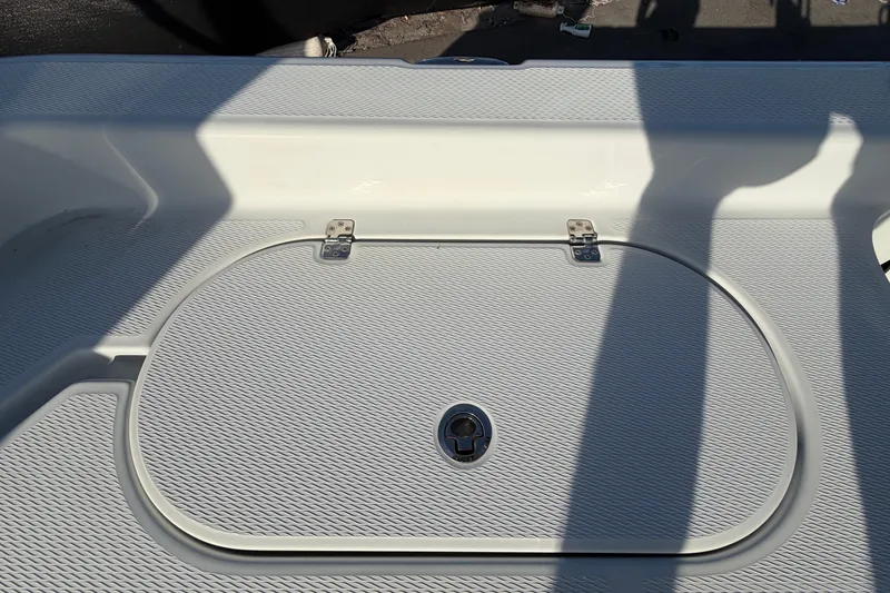 Slide: The Image of 2018 Blue Wave 2800 Pure Hybrid boat deck with storage hatch and textured surface. - 79