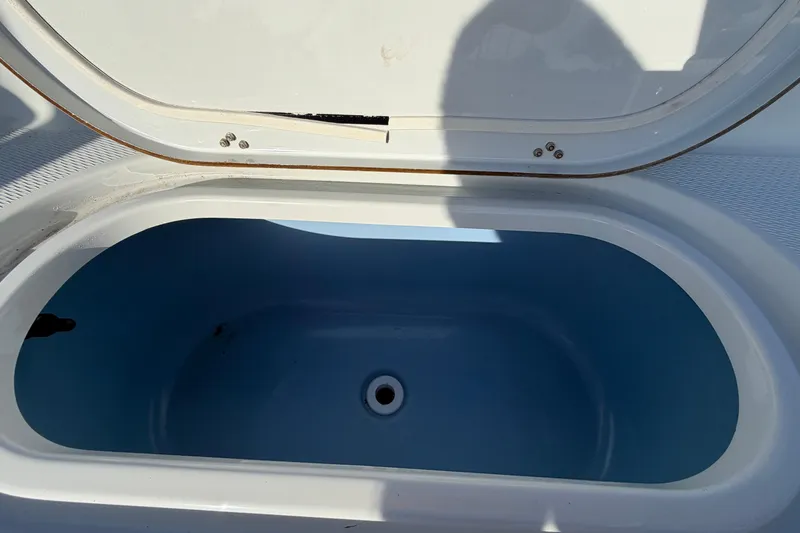 Slide: The Image of Open storage compartment on 2018 Blue Wave 2800 Pure Hybrid boat. - 80
