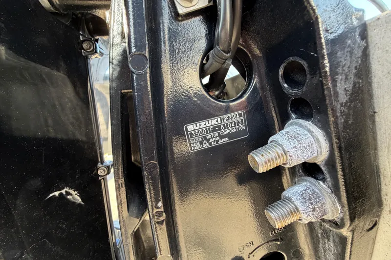 Slide: The Image of Trailer wheels of a 2018 Blue Wave 2800 Pure Hybrid boat on pavement. - 82