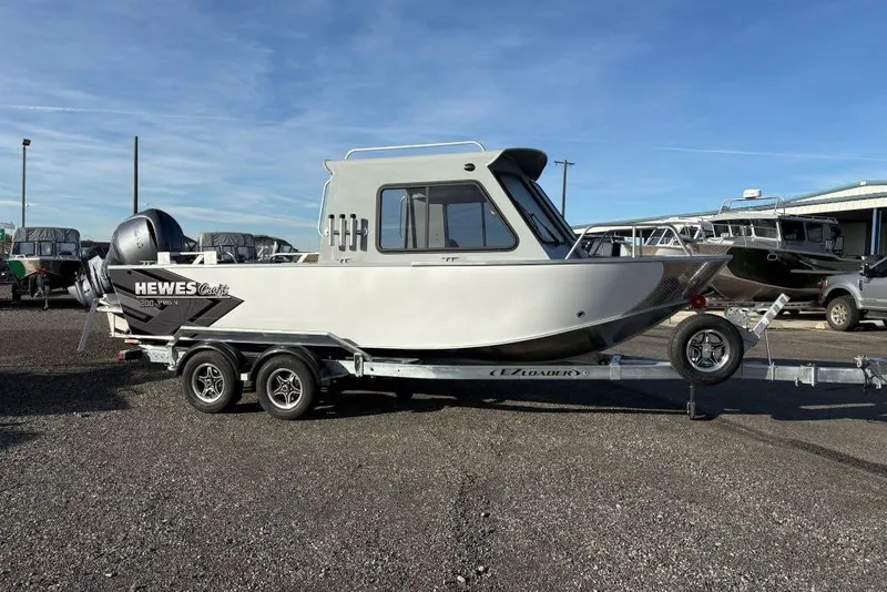 The Image of 2026 Hewescraft 200 ProV ET HT boat on trailer, parked outdoors. - 1