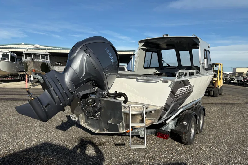 Slide: The Image of 2026 Hewescraft 200 ProV ET HT boat with Yamaha outboard motor, parked on a trailer. - 3