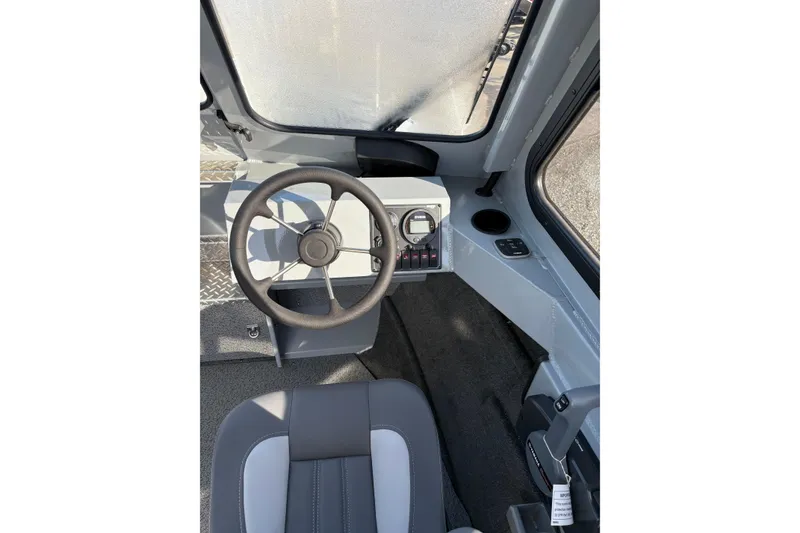 Slide: The Image of 2026 Hewescraft 200 ProV ET HT boat interior with steering wheel and dashboard controls. - 5