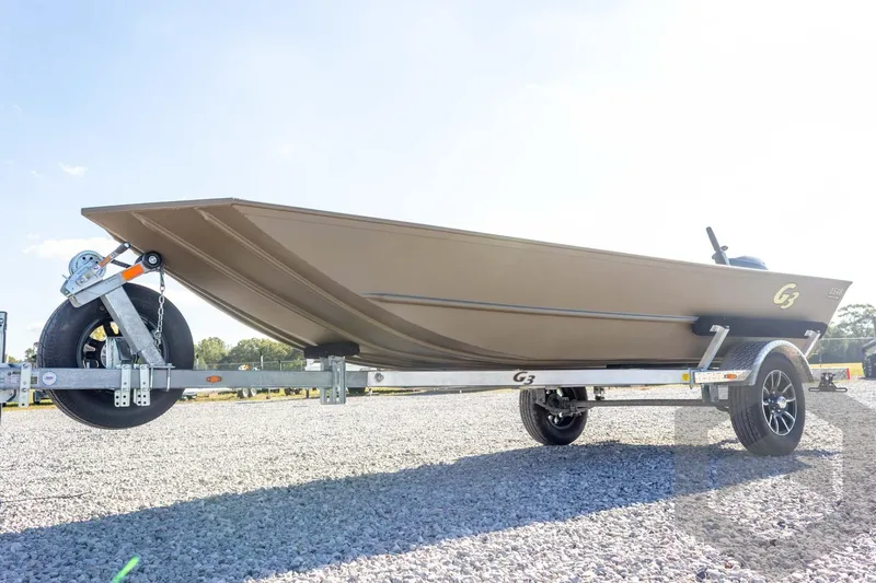 Slide: The Image of 2026 G3 Gator Tough 1548 VBW boat on trailer, parked on gravel. - 10