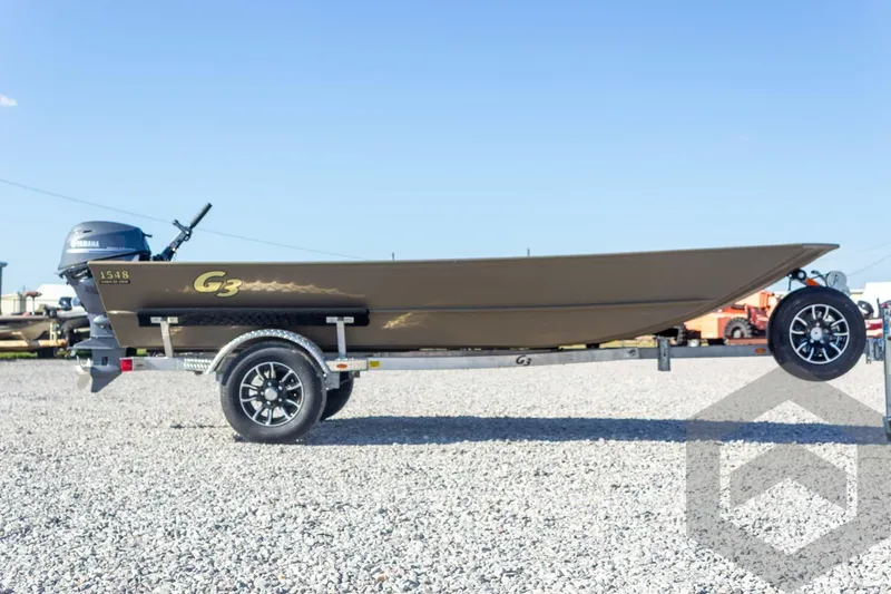 Slide: The Image of 2026 G3 Gator Tough 1548 VBW boat on trailer, side view, outdoors. - 13