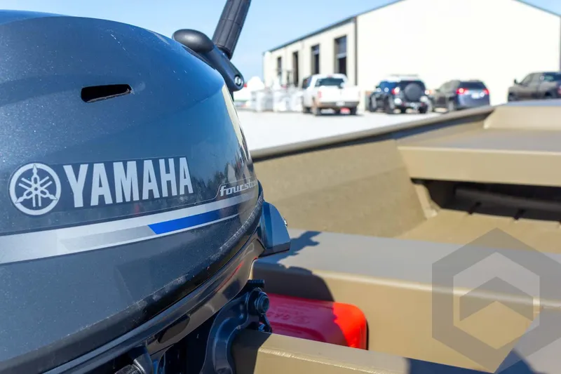 Slide: The Image of 2026 G3 Gator Tough 1548 VBW boat with Yamaha outboard motor in a parking lot. - 20