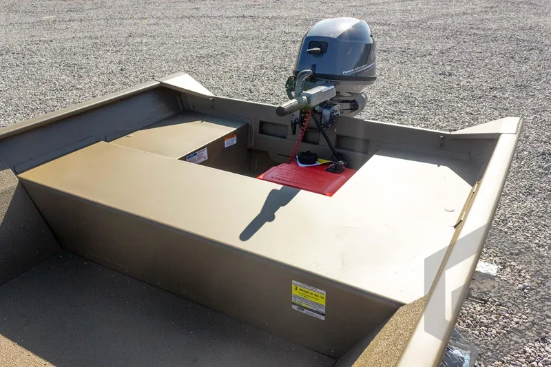 Slide: The Image of 2026 G3 Gator Tough 1548 VBW boat with outboard motor on gravel surface. - 27