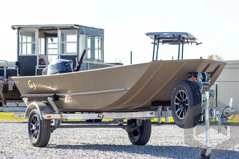 Slide: The Image of 2026 G3 Gator Tough 1548 VBW boat on trailer, parked outdoors. - 3