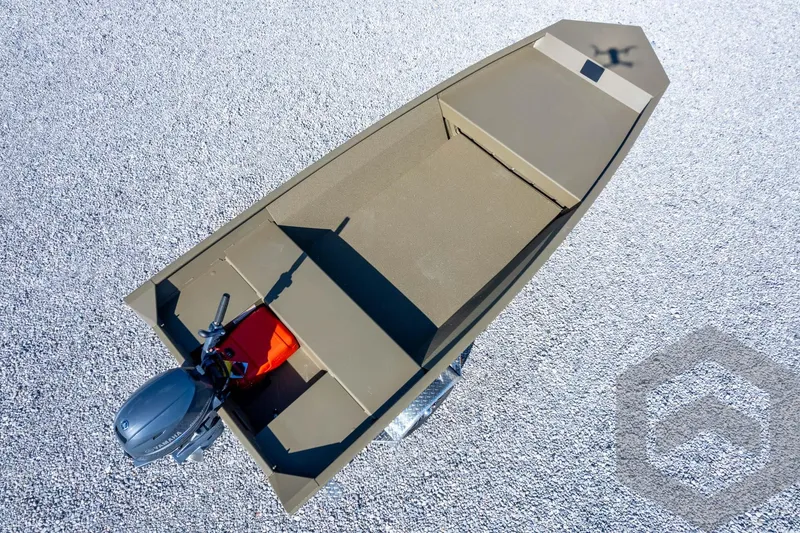 Slide: The Image of 2026 G3 Gator Tough 1548 VBW boat, aerial view on gravel surface. - 42