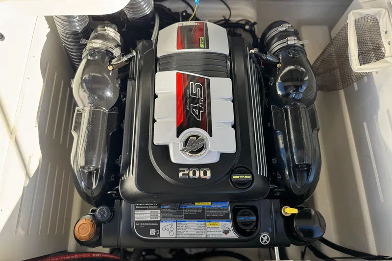 Slide: The Image of 2023 Bayliner DX 2050 engine, featuring a 4.5L 200 horsepower MerCruiser. - 18