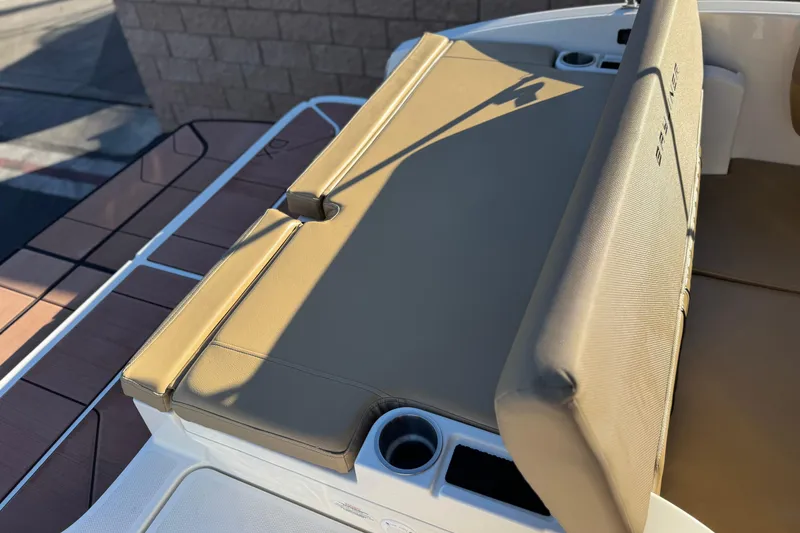 Slide: The Image of 2023 Bayliner DX 2050 boat with tan seating and cup holders. - 20
