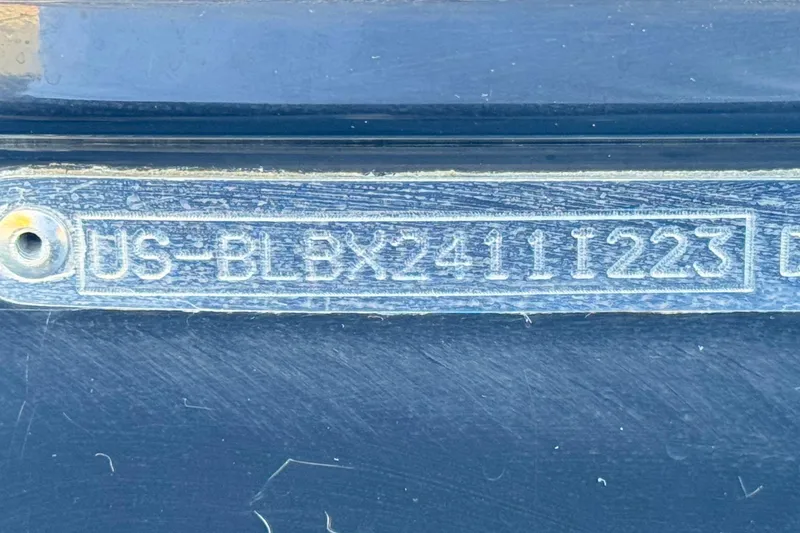 Slide: The Image of 2023 Bayliner DX 2050 hull identification number (HIN) plate close-up. - 33